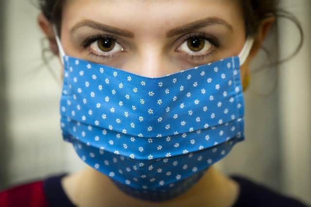 A woman wearing a face covering. Leaders are urging people to stay safe, and calling on the Government to give more powers and advice for dealing with the covid situation in the region.