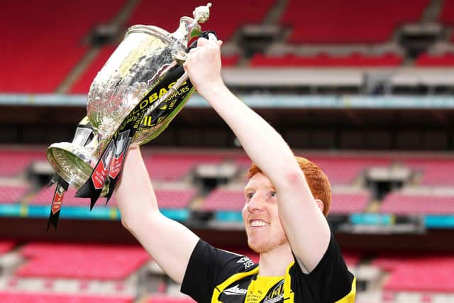 Hebburn Town's Michael Richardson celebrates with lifting the Buildbase FA Vase 2019/20 Trophy after victory in the Final at Wembley Stadium, London.