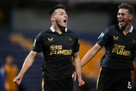 Dylan Stephenson (L)  celebrates with his teammate Cameron Ferguson of Newcastle United after scoring his team's first goal during the Papa John's EFL Trophy Group match between Mansfield  Town and Newcastle United U21 at  on November 09, 2021 in Mansfield, England. (Photo by Laurence Griffiths/Getty Images)