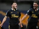 Dylan Stephenson (L)  celebrates with his teammate Cameron Ferguson of Newcastle United after scoring his team's first goal during the Papa John's EFL Trophy Group match between Mansfield  Town and Newcastle United U21 at  on November 09, 2021 in Mansfield, England. (Photo by Laurence Griffiths/Getty Images)