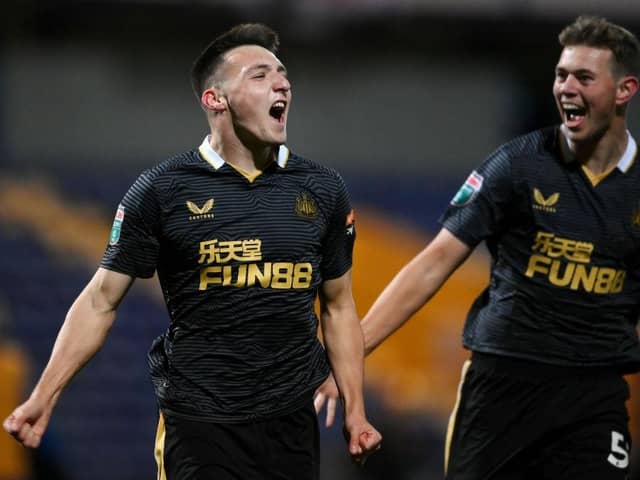 Dylan Stephenson (L)  celebrates with his teammate Cameron Ferguson of Newcastle United after scoring his team's first goal during the Papa John's EFL Trophy Group match between Mansfield  Town and Newcastle United U21 at  on November 09, 2021 in Mansfield, England. (Photo by Laurence Griffiths/Getty Images)