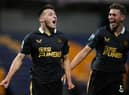 Dylan Stephenson (L)  celebrates with his teammate Cameron Ferguson of Newcastle United after scoring his team's first goal during the Papa John's EFL Trophy Group match between Mansfield  Town and Newcastle United U21 at  on November 09, 2021 in Mansfield, England. (Photo by Laurence Griffiths/Getty Images)