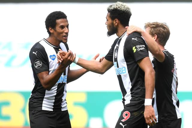 Isaac Hayden, left, congratulates Joelinton.