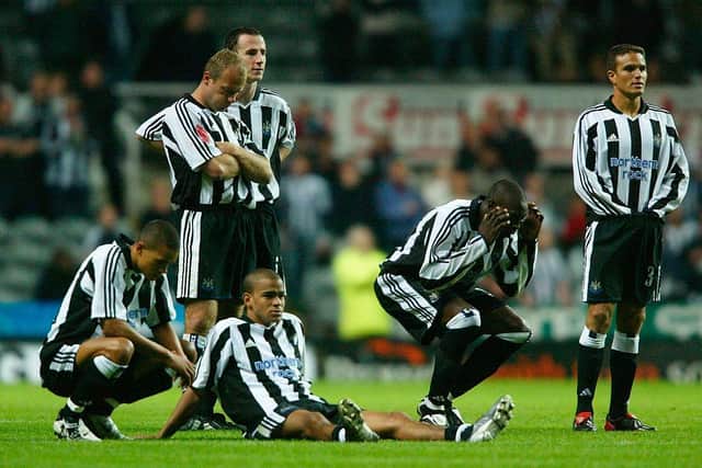 Newcastle United players look dejected after Aaron Hughes misses his penalty during the Champions League defeat to Partizan Belgrade at St James's Park.