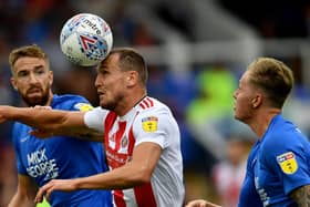 Sunderland striker Charlie Wyke battles for the ball.