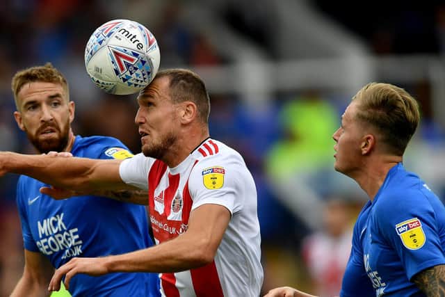 Sunderland striker Charlie Wyke battles for the ball.