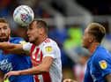 Sunderland striker Charlie Wyke battles for the ball.