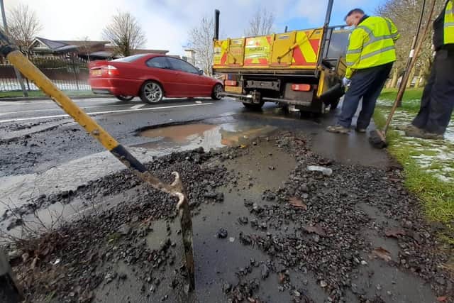 Road workers are at the scene to try and drain the water.