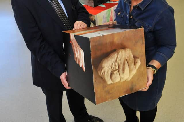 Councillors Alan Kerr and Tracey Dixon, and Librarian Tom Relph, centre, with the Dementia Photo Cubes at Cleadon Library in 2017.