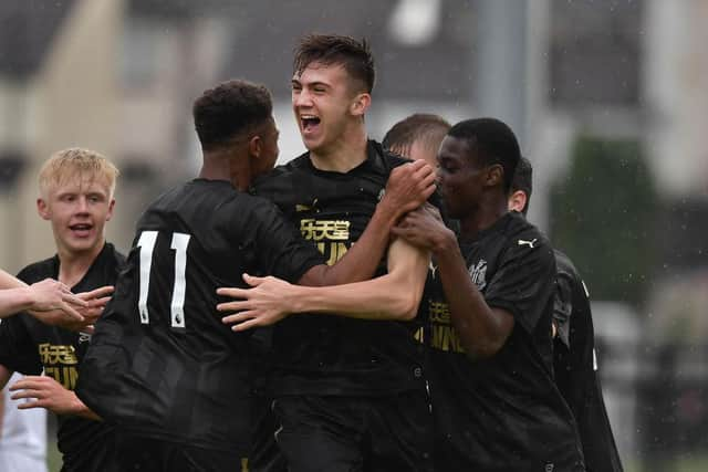 LIMAVADY, NORTHERN IRELAND - JULY 26: Oisin McEntee (C) of Newcastle United celebrates with team mates after opening the scoring with a header during the Super Cup NI u18 tournament group game between Newcastle United u18's and Komazawa University FC u18's at Scroggy Road on July 26, 2017 in Limavady, Northern Ireland. (Photo by Charles McQuillan/Getty Images)