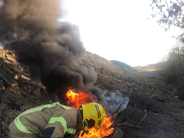 Firefighters tackle a deliberate fire