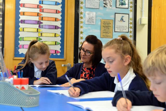 Ashley Academy headteacher Denise Todd working with pupils.