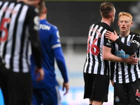 NEWCASTLE UPON TYNE, ENGLAND - JANUARY 03: Matthew Longstaff (r) of Newcastle United is consoled by brother Sean Longstaff after the Premier League match between Newcastle United and Leicester City at St. James Park on January 03, 2021 in Newcastle upon Tyne, England. The match will be played without fans, behind closed doors as a Covid-19 precaution. (Photo by Stu Forster/Getty Images)