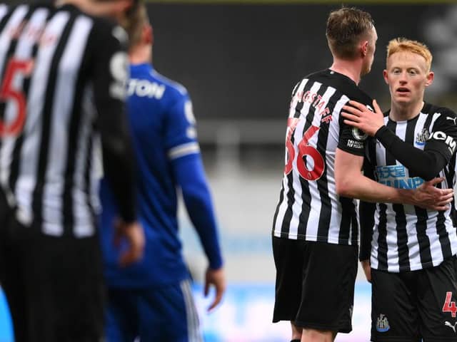 NEWCASTLE UPON TYNE, ENGLAND - JANUARY 03: Matthew Longstaff (r) of Newcastle United is consoled by brother Sean Longstaff after the Premier League match between Newcastle United and Leicester City at St. James Park on January 03, 2021 in Newcastle upon Tyne, England. The match will be played without fans, behind closed doors as a Covid-19 precaution. (Photo by Stu Forster/Getty Images)