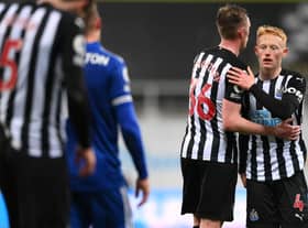 NEWCASTLE UPON TYNE, ENGLAND - JANUARY 03: Matthew Longstaff (r) of Newcastle United is consoled by brother Sean Longstaff after the Premier League match between Newcastle United and Leicester City at St. James Park on January 03, 2021 in Newcastle upon Tyne, England. The match will be played without fans, behind closed doors as a Covid-19 precaution. (Photo by Stu Forster/Getty Images)