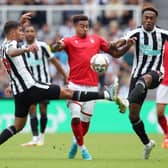 Jesse Lingard of Nottingham Forest is challenged by Bruno Guimaraes and Joe Willock of Newcastle United during the Premier League match between Newcastle United and Nottingham Forest at St. James Park on August 06, 2022 in Newcastle upon Tyne, England. (Photo by Jan Kruger/Getty Images)
