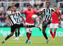 Jesse Lingard of Nottingham Forest is challenged by Bruno Guimaraes and Joe Willock of Newcastle United during the Premier League match between Newcastle United and Nottingham Forest at St. James Park on August 06, 2022 in Newcastle upon Tyne, England. (Photo by Jan Kruger/Getty Images)