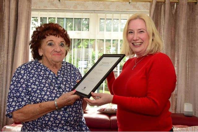 June Coser receiving her Point of Light Award from South Shields MP, Emma Lewell-Buck