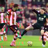Burnley's Irish midfielder Jeff Hendrick (C) controls the ball during the English Premier League football match between Southampton and Burnley at St Mary's Stadium in Southampton, southern England on February 15, 2020.