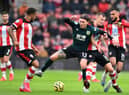 Burnley's Irish midfielder Jeff Hendrick (C) controls the ball during the English Premier League football match between Southampton and Burnley at St Mary's Stadium in Southampton, southern England on February 15, 2020.