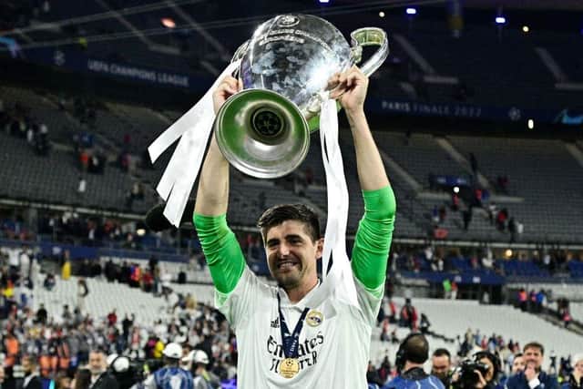 Thibaut Courtois celebrates with the trophy after the UEFA Champions League final football match between Liverpool and Real Madrid at the Stade de France in Saint-Denis, north of Paris, on May 28, 2022. - Real Madrid won the match 0-1. (Photo by JAVIER SORIANO / AFP) (Photo by JAVIER SORIANO/AFP via Getty Images)