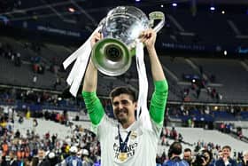 Thibaut Courtois celebrates with the trophy after the UEFA Champions League final football match between Liverpool and Real Madrid at the Stade de France in Saint-Denis, north of Paris, on May 28, 2022. - Real Madrid won the match 0-1. (Photo by JAVIER SORIANO / AFP) (Photo by JAVIER SORIANO/AFP via Getty Images)