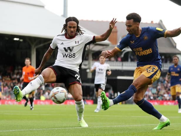 Jacob Murphy of Newcastle United is challenged by Kevin Mbabu of Fulham during the Premier League match between Fulham FC and Newcastle United at Craven Cottage on October 01, 2022 in London, England. (Photo by Henry Browne/Getty Images)