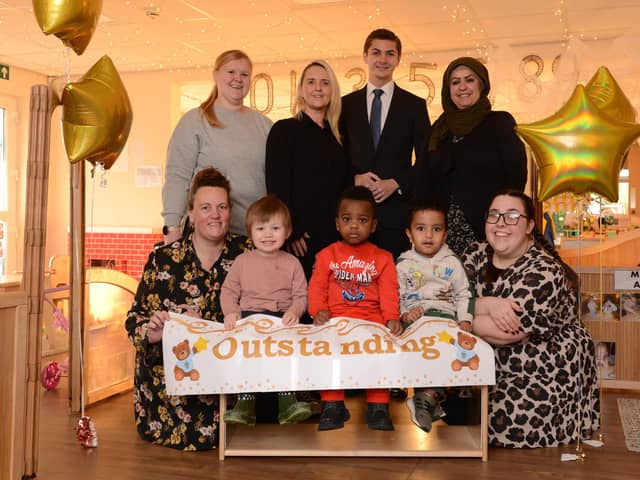 Cllr Adam Ellison celebrates Stanley's at Marine Park's  outstanding Ofsted with staff and children.