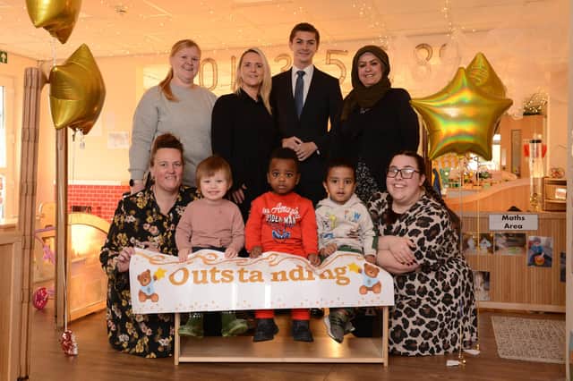 Cllr Adam Ellison celebrates Stanley's at Marine Park's  outstanding Ofsted with staff and children.