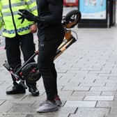 File picture of an e-scooter rider being stopped.