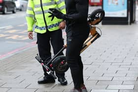 File picture of an e-scooter rider being stopped.