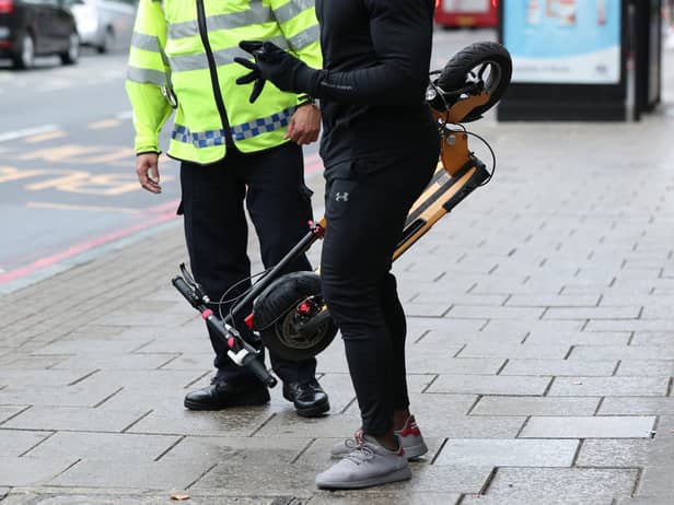 File picture of an e-scooter rider being stopped.