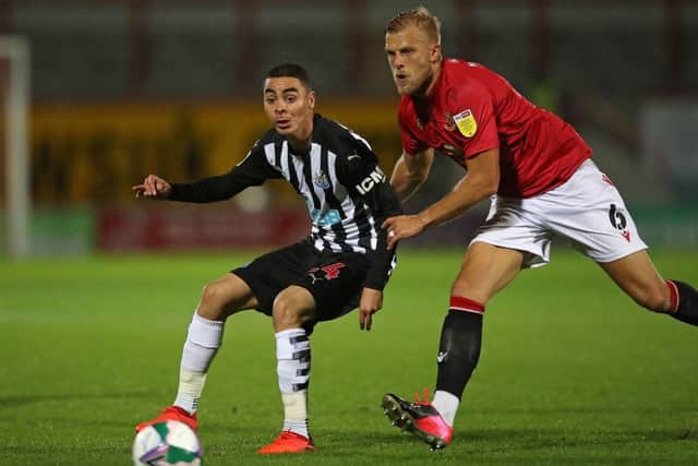 Newcastle United's Paraguayan midfielder Miguel Almiron (L) vies with Morecambe's English defender Harry Davis (R) during the English League Cup third round football match between Morecambe and Newcastle United at The Mazuma Stadium in north-west England, on September 23, 2020.