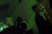 Body cam footage shows floods of people leaving  the illegal rave.