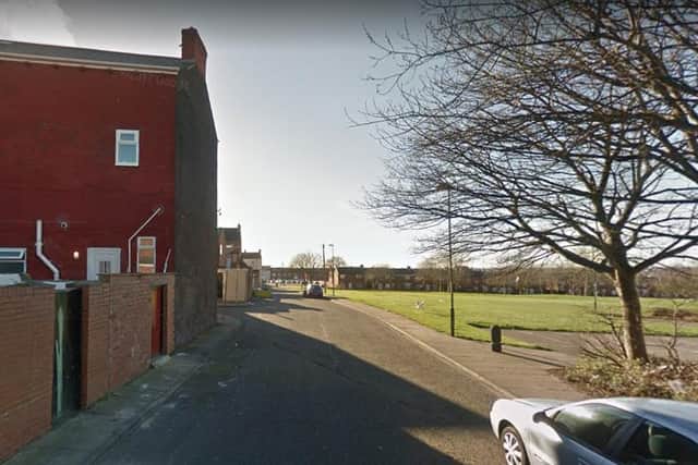 The woman was robbed at knife point in the back lane behind Dean Road in South Shields