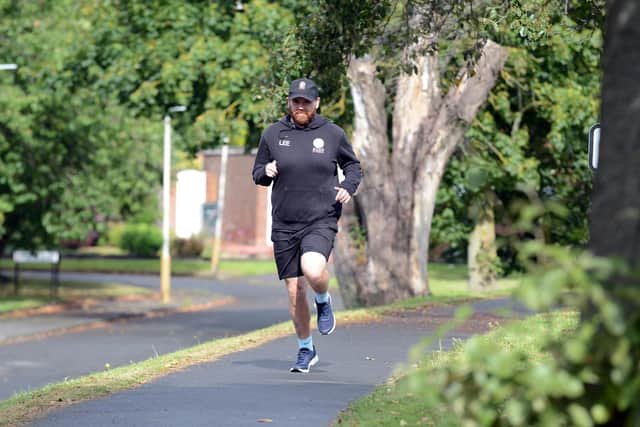 Personal trainer Lee Nelson is to run 84 miles from Carlisle to Newcastle.