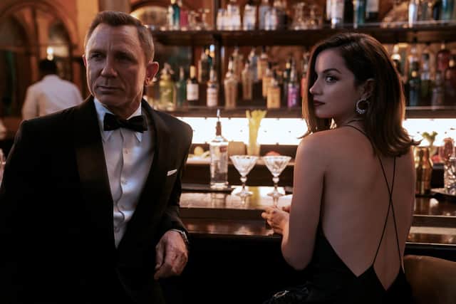 Daniel Craig with Ana de Armas in No Time To Die. See question 28. PA photograph.