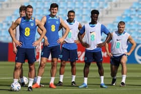 England captain Harry Kane (l) alongside John Stones, Harry Maguire , Callum Wilson, Bukayo Sako and Eric Dier during the England Press Conference at Al Wakrah Stadium on November 17, 2022 in Doha, Qatar. (Photo by Michael Steele/Getty Images)