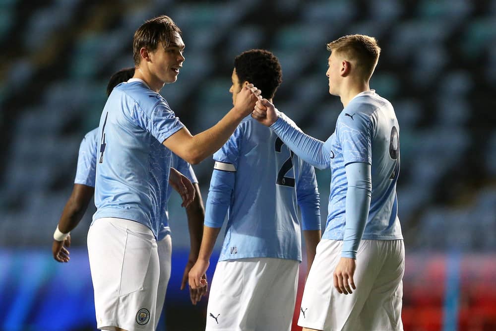 Callum Doyle (left) celebrates with teammate Liam Delap (right)