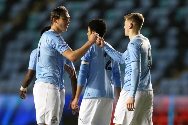 Callum Doyle (left) celebrates with teammate Liam Delap (right)