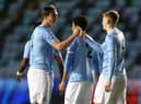 Callum Doyle (left) celebrates with teammate Liam Delap (right)