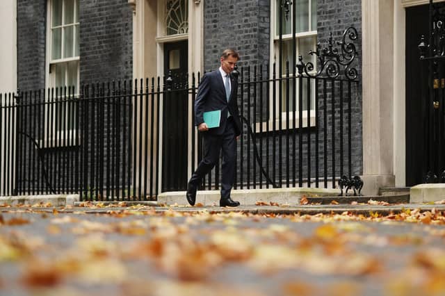 Chancellor of the Exchequer Jeremy Hunt departs Downing Street to present the Autumn Statement to the House of Commons.