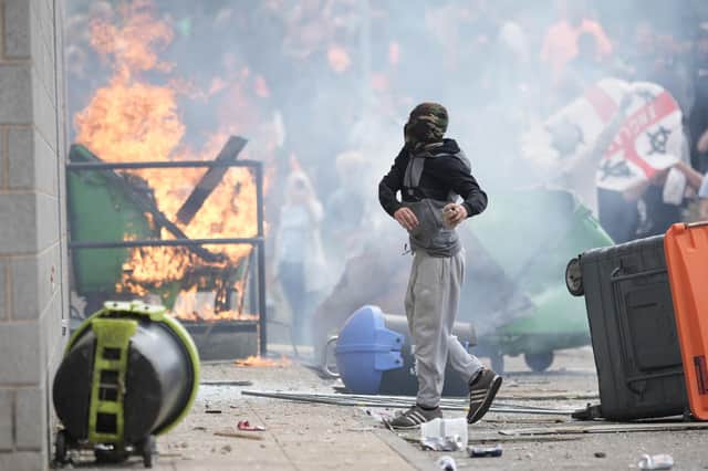 Anti-migration protesters are seen during riots outside of the Holiday Inn Express in Manvers, which is being used as an asylum hotel, in Rotherham. Picture: Christopher Furlong/Getty Images