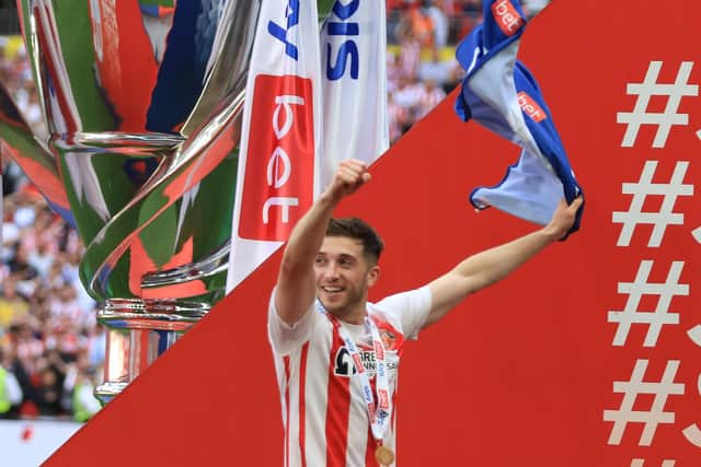 Lynden Gooch celebrates after winning promotion with Sunderland.