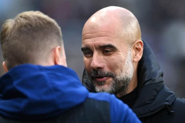 Newcastle manager Eddie Howe chats with Pep Guardiola before the Premier League match between Newcastle United  and  Manchester City at St. James Park on December 19, 2021 in Newcastle upon Tyne, England. (Photo by Stu Forster/Getty Images)