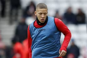 Stoke City striker Dwight Gayle warms up at the Stadium of Light.