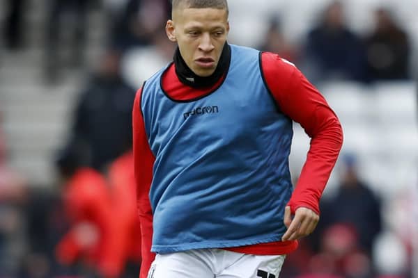 Stoke City striker Dwight Gayle warms up at the Stadium of Light.