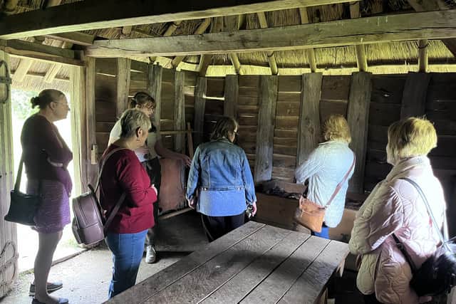 Members of the Creative Calligraphers group inside the Monk Cell.