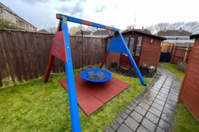 The swing acts as a sensory device for Ethan.