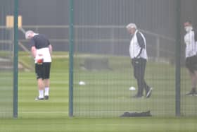 Head coach Steve Bruce, centre, on the training pitch.